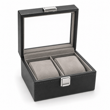 Black leather watch box with clear lid and two cushioned compartments for luxury timepieces
